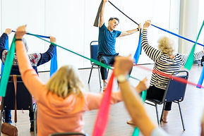 Older women taking part in chair exercises