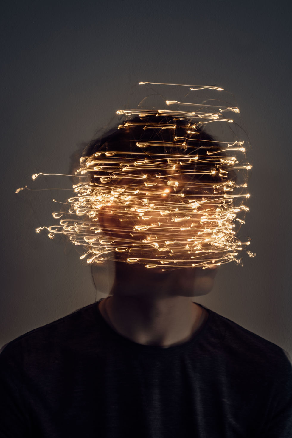 An image of a person's head with many small lights around it