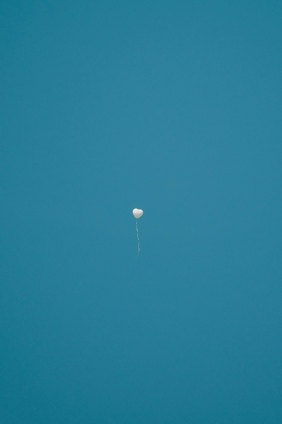 Image of a balloon floating away.