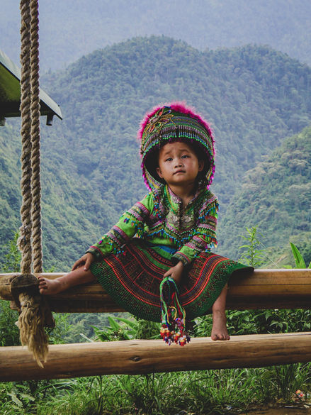 Image of a child in traditional costume from Sapa Valley Vietnam