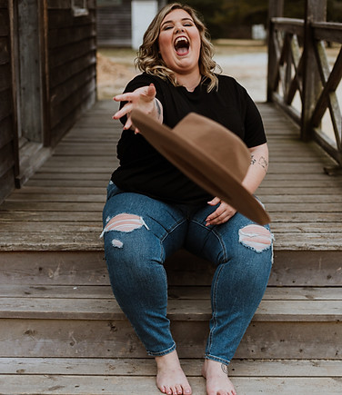 Image of a woman sitting on wooden steps, throwing a hat. Discover how EMDR therapy benefits individuals seeking healing and relief from various concerns, such as trauma, anxiety, phobias, and more.Image by Jade Destiny