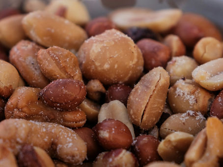 A close-up view of a delicious assortment of mixed nuts, lightly salted and ready for snacking.