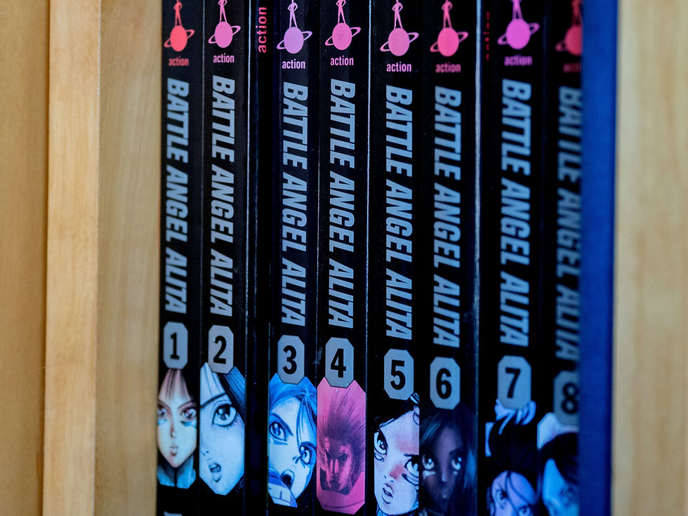 Eye-level view of a stack of colorful comic books arranged neatly