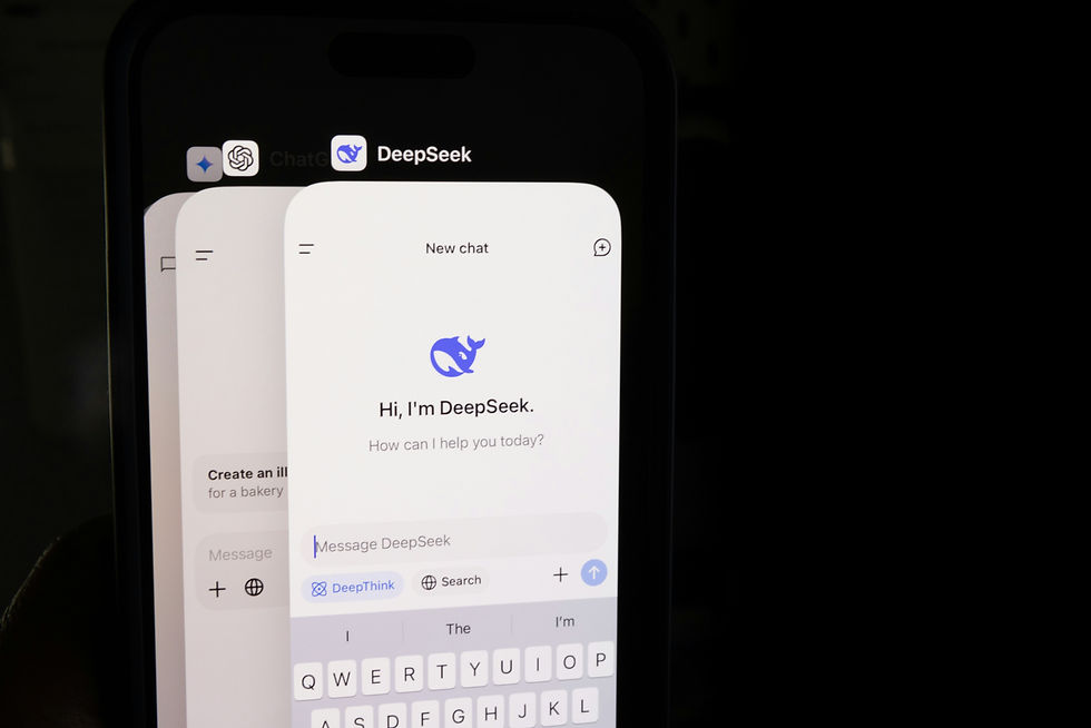 Phone screen showing a chat app called DeepSeek, with a blue whale logo. Text reads "Hi, I'm DeepSeek. How can I help you today?"