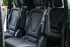 Luxurious and spacious interior of a Mercedes-Benz V-Class van with premium leather seats, elegant design and ample legroom, perfect for comfortable long-distance private transfers by MYEUTAXI