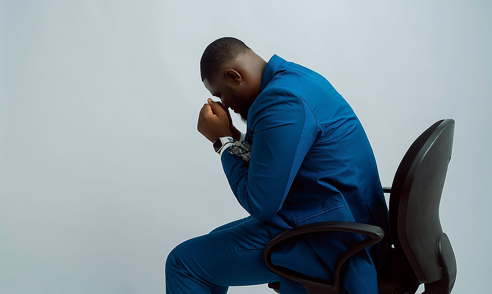 Business man hunched over