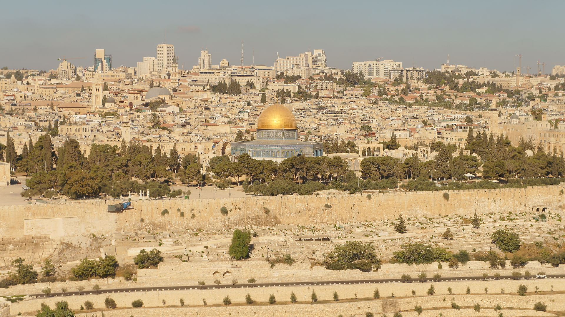 Close-up of the Temple Mount and the golden Dome of the Rock shimmering in the afternoon sun.