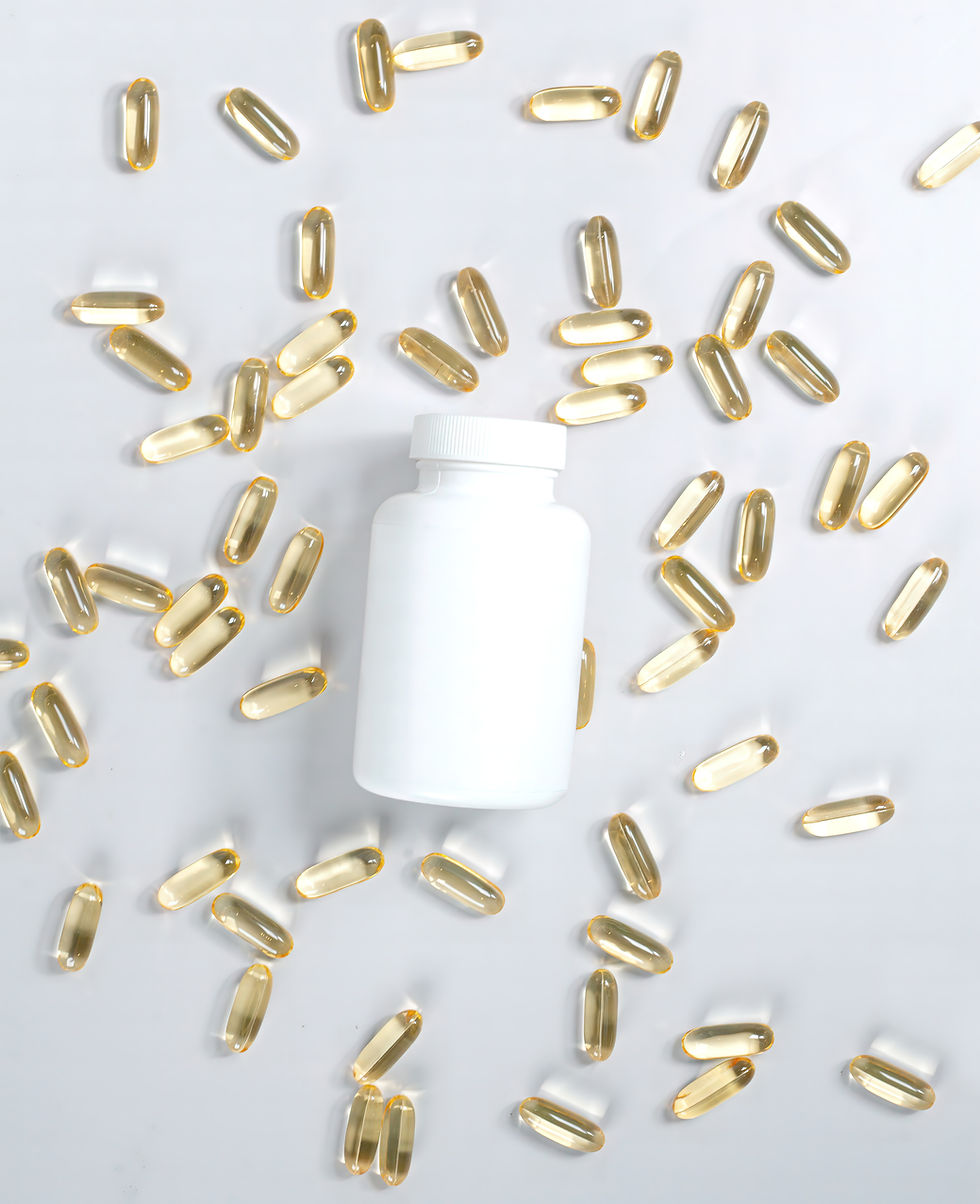 White bottle surrounded by scattered yellow capsules on a light background. Capsules glisten, creating a clean and clinical mood.