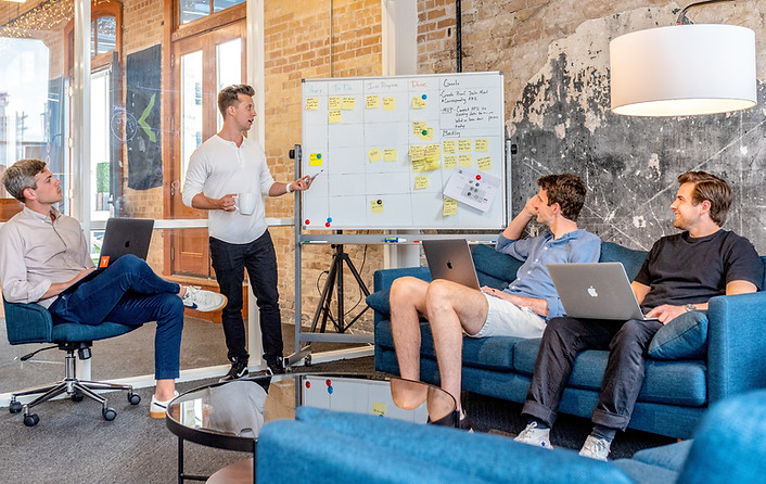 Team leader applying growth leadership skills learned through coaching to foster employee engagement and positive culture.