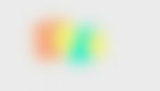 Blurry gradient with orange, yellow, green, and teal shades on a gray background. No text or distinct shapes visible. Abstract and soft mood. Represents Color Blindness.