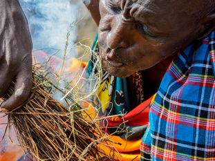 A maasai man making fire traditionally