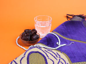 Dates and water on prayer rug for Ramadan | Support During Ramadan | South Asian Therapists | South Asian Therapy in NYC | Therapy in New York City | 10001 | 10002 | 10003 | 10009
