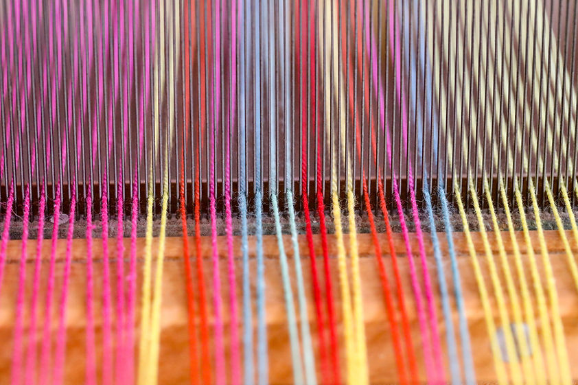 colorful Yarn being woven on a machine
