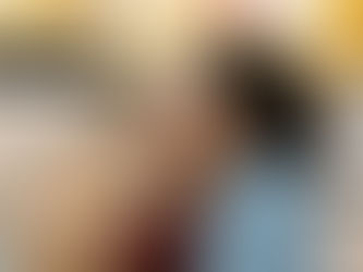 two women close to each other next to a horse