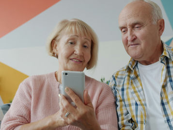two people looking at cellphone