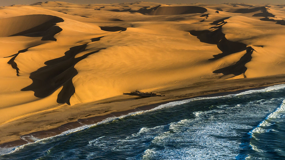 Eye-level view of a large red sand dune in the Namib Desert near Sandwich Harbour