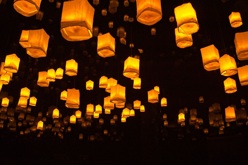 Lanterns float in the night sky, symbolizing hope, resilience, and compassion, as they illuminate the darkness with their gentle glow.