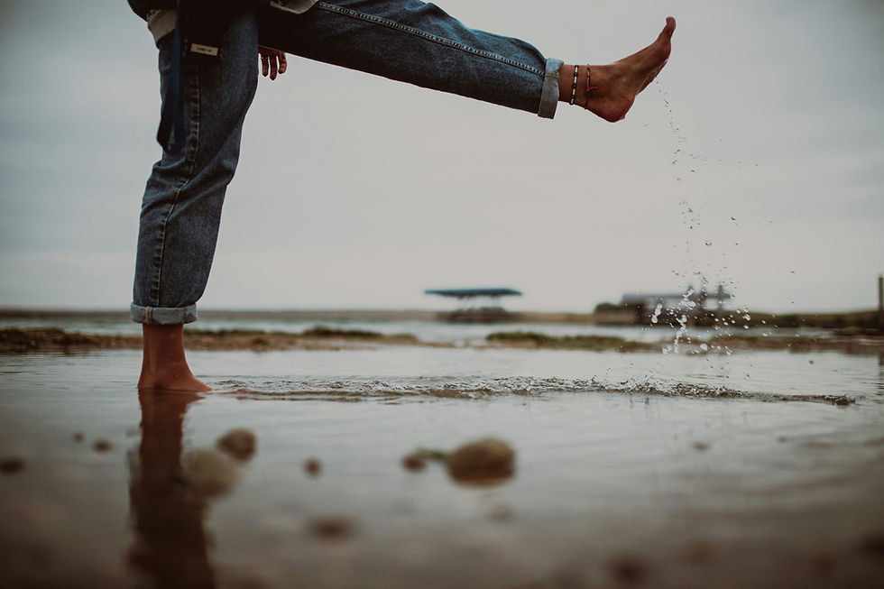 Kicking a rock at the beach