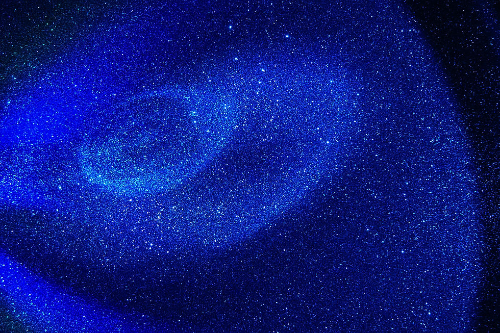 An image of space with dark blue colours and circles of light