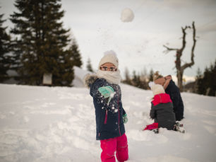 family playing snowball