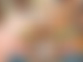 a woman sitting at the comuna 13 steps surrounded by murals and street art