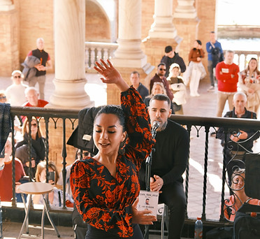 Elegant Spanish woman performing a passionate flamenco dance in a traditional red dress, capturing the rhythm, movement, and vibrant culture of Spain