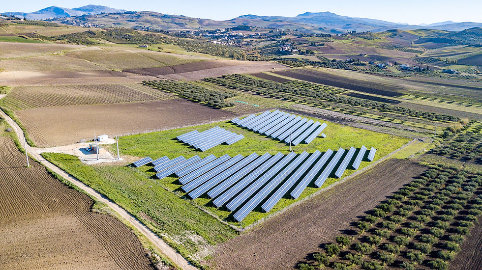 Solar panels renewable energy in a field surrounded by grass and dirt