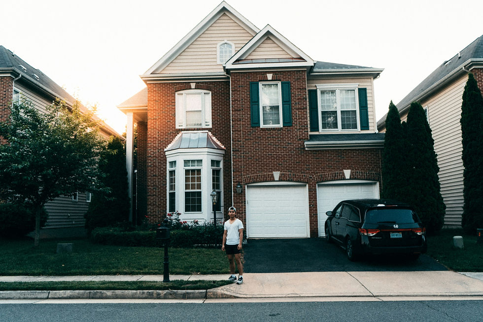 Someone standing outside their home.