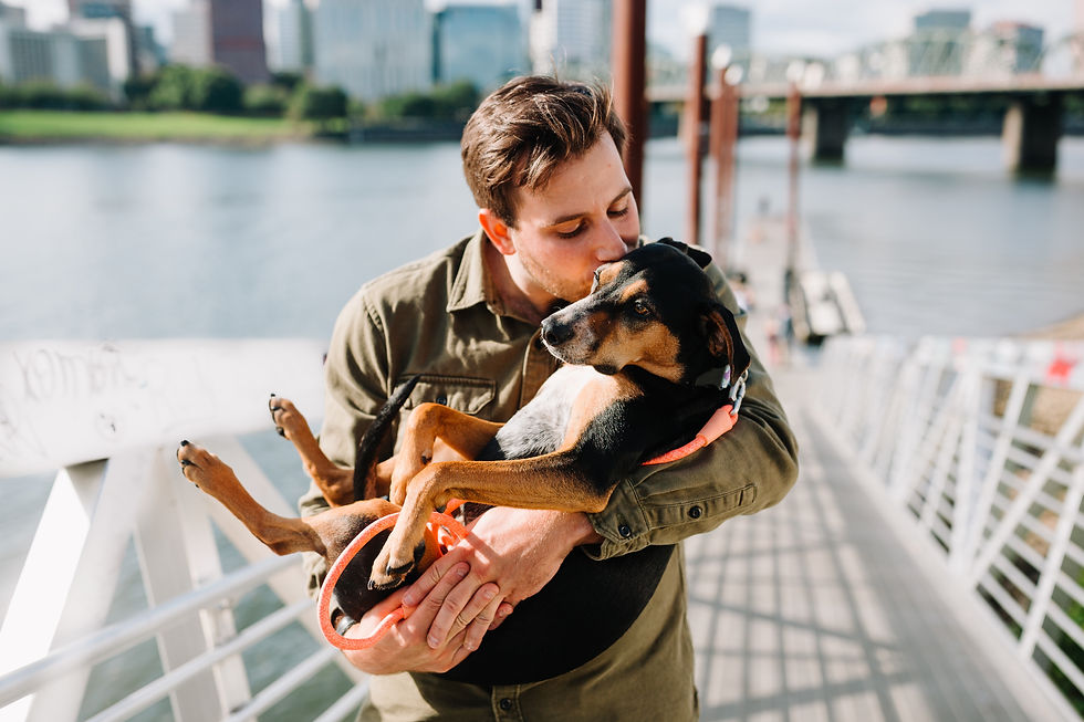 man kissing his dog can talk to his pet with acupressure