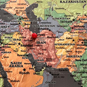 A Map of the Middle East with a pin on Iran