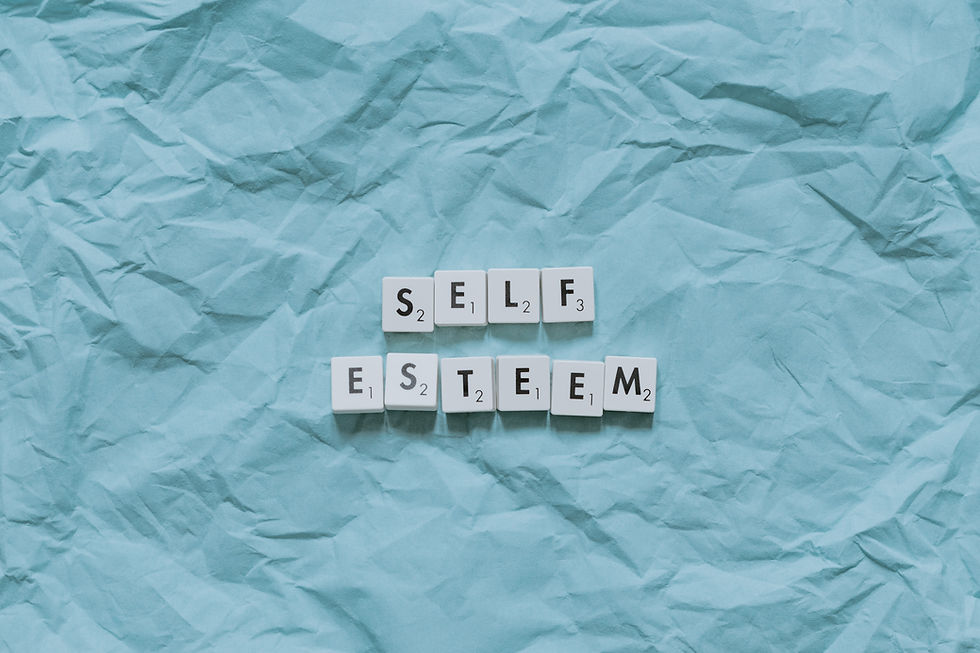 Scrabble letters spelling the words Self Esteem