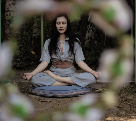 woman meditating cross legged