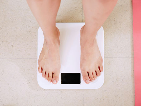 man standing bathroom scales