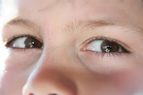 Macro close-up of a child's eyes and brow
