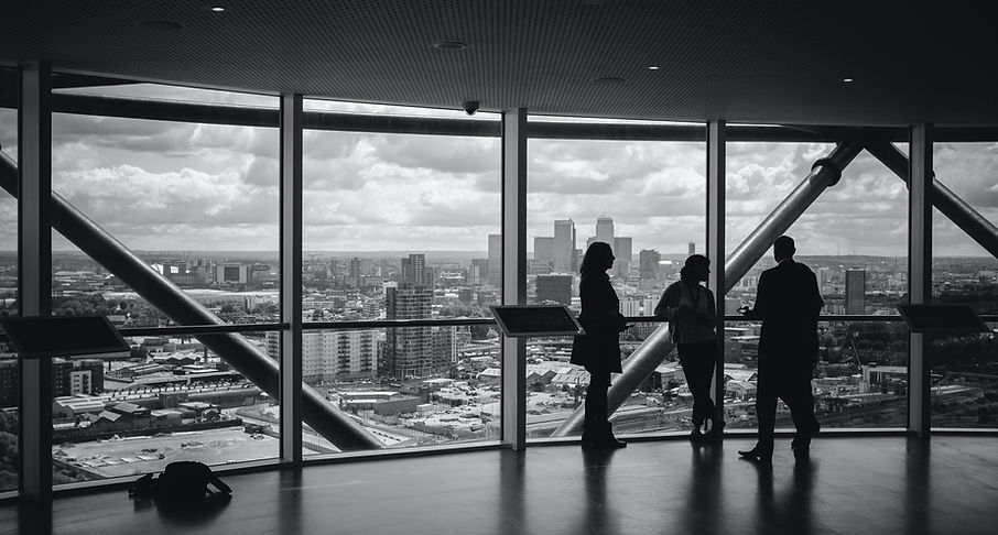 Young entreprenuers in front of window | Soft Skills Training | Management Mentors International