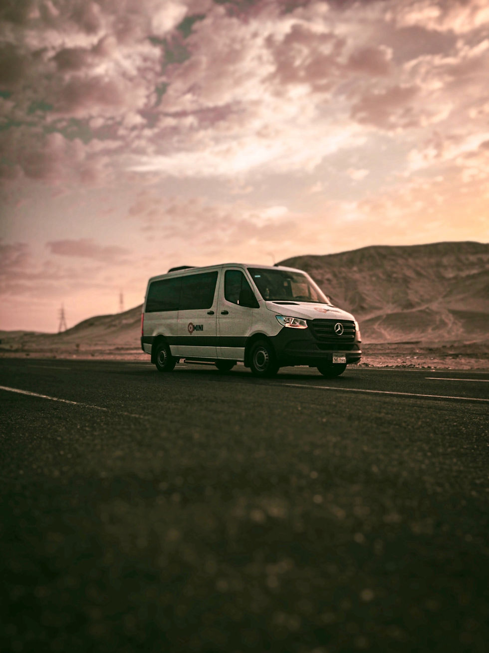 van on road at dawn