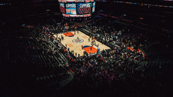 NBA Basketball game at Staples Center, crowd celebrating a Clippers win.