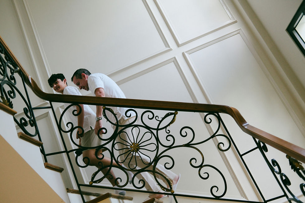 Teen and parent walking together at home, practicing decision-making and daily living skills.