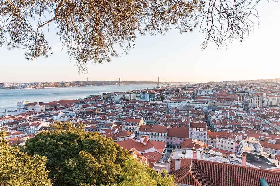 Traditional yellow tram passing through the historic streets of Lisbon