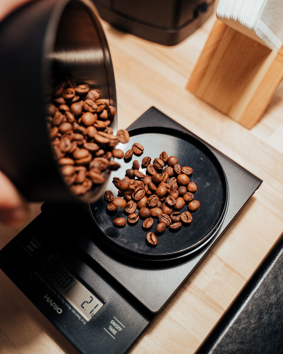 Whole bean coffee weighed on a scale