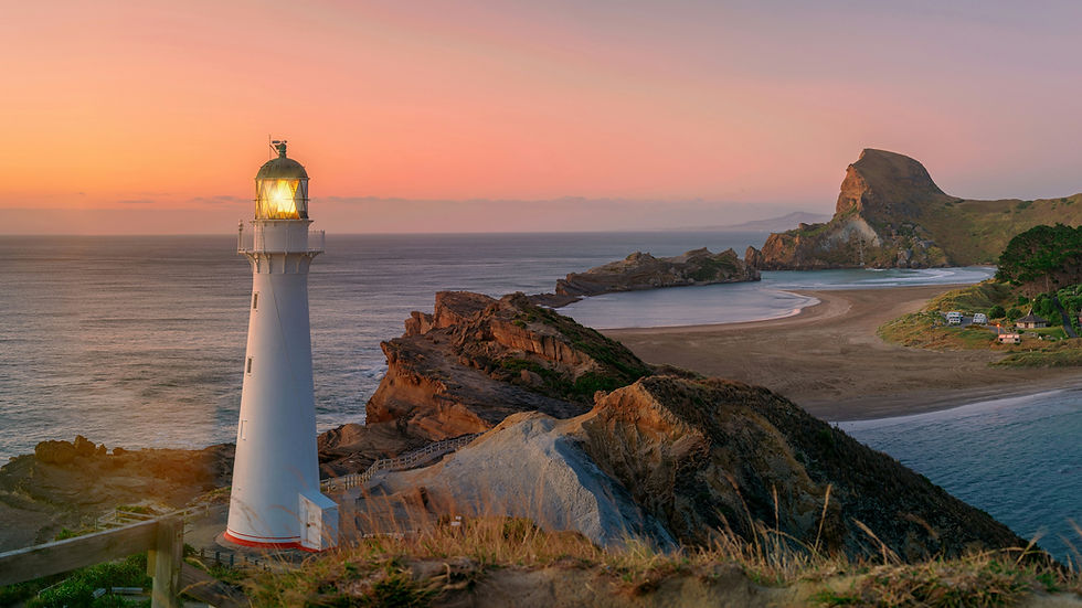 Castlepoint Lighthouse stands majestically on a cliff, providing a watchful eye over the ocean at first morning light, with Castle Rock towering in the background.