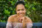 a woman smiling confidently into the camera