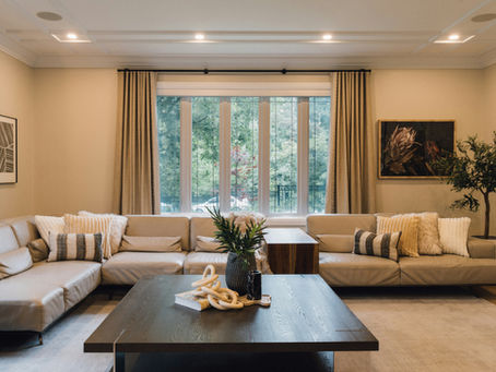 A warm, elegantly styled living room in a professionally managed short-let property