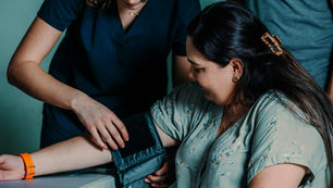 Physiotherapist consulting with patient in clinic setting