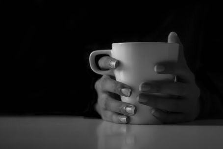 hands holding a tea cup