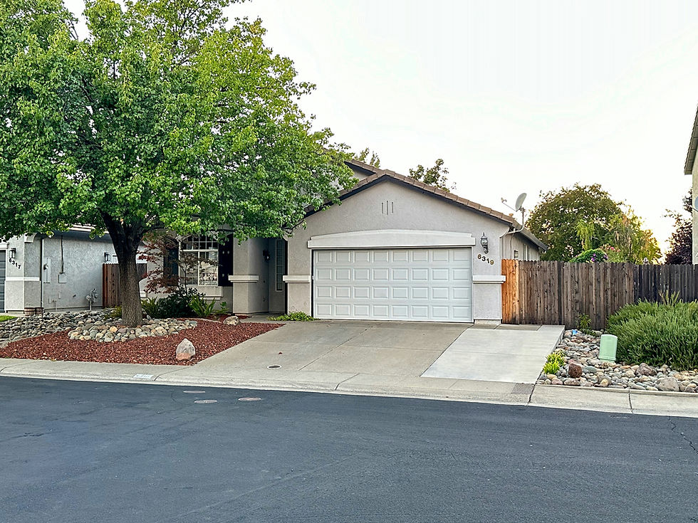 Suburban home with mature trees in the yard
