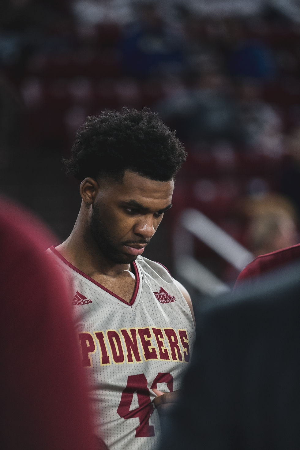 Basketball player mid-action on the court, caught between plays, symbolizing the transition between identity as an athlete and the deeper self beneath the role—explored through transformational coaching with Command Performance Coaching in Loudoun County VA.