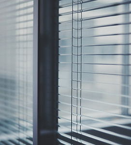 Image by Vista Wei. Blinds over a window.