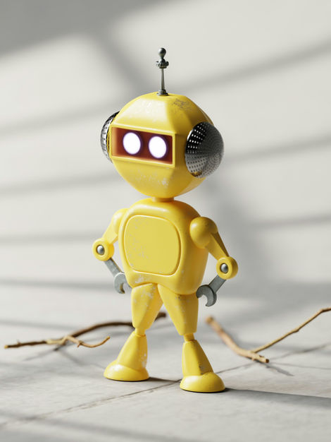 a yellow toy robot with a wrench on its arm