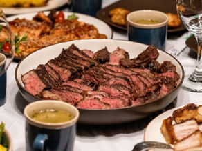 a feast with steak centerpiece